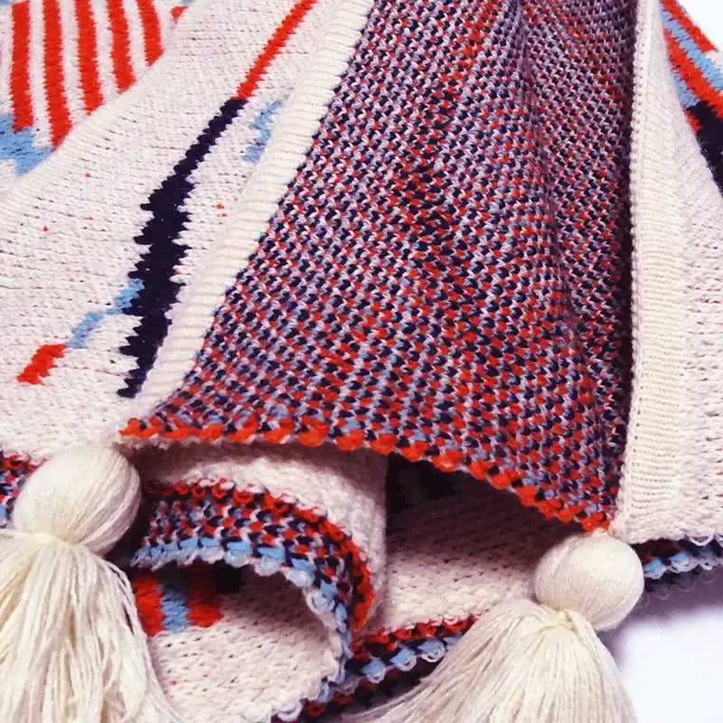 Bohemian knitted sofa blanket with geometric pattern in cream red navy and light blue yarns decorbites bedroom throw decor