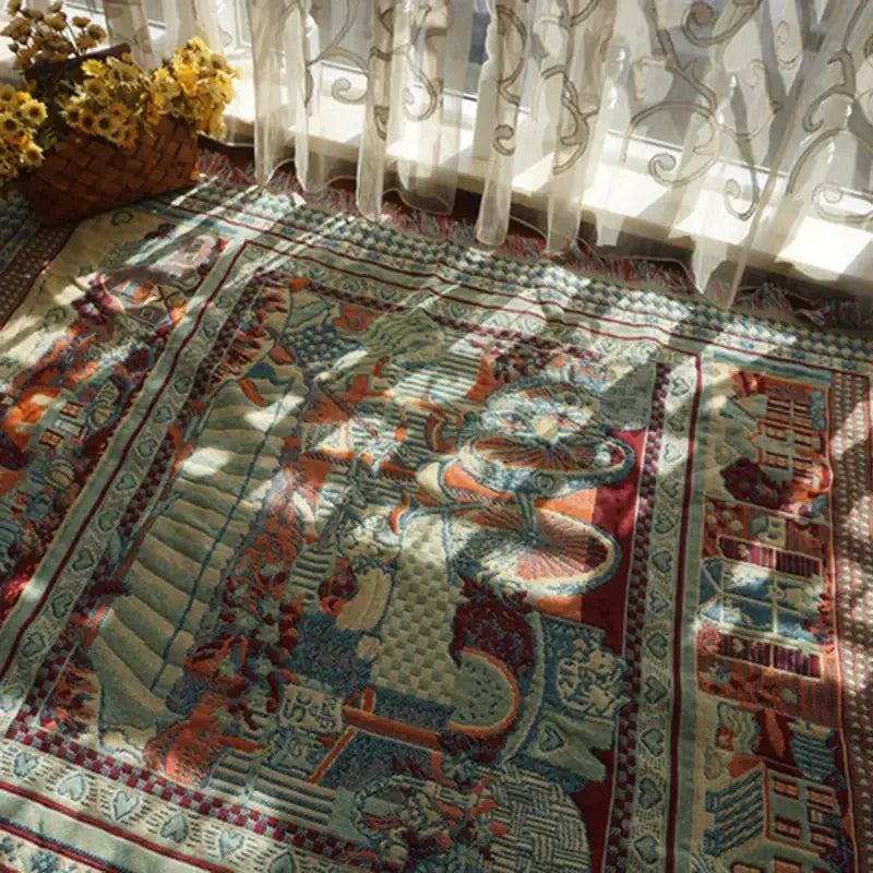 Bohemian knitted sofa cover by decorbites featuring an earth tone rectangular rug pattern with stylized figures and borders