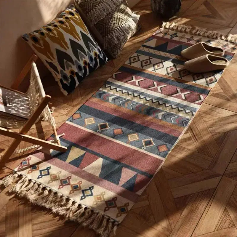 A cozy bohemian linen plaid cotton weave runner rug in terracotta navy and cream with geometric patterns and fringed edges