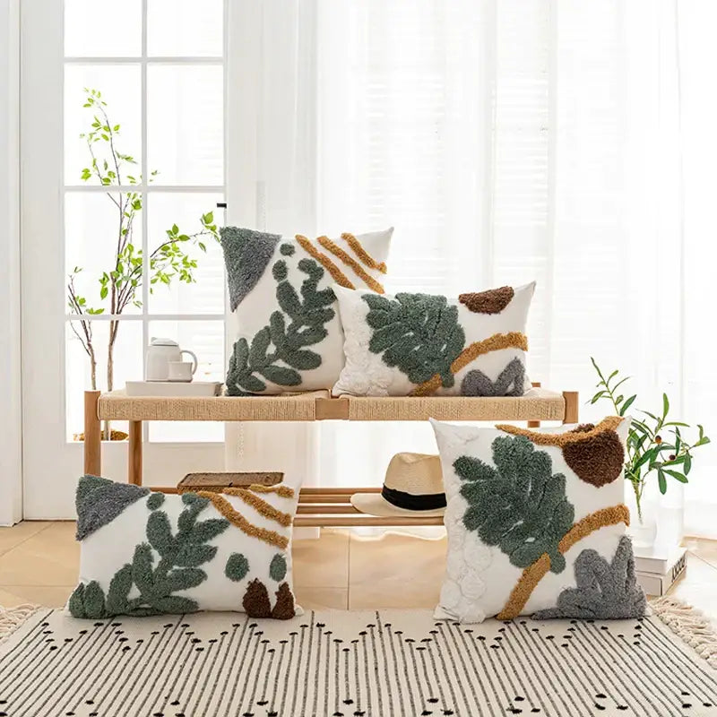 White throw pillows with bohemian loop plush cushion cover featuring textured green brown and gray leaf patterns for living room decor