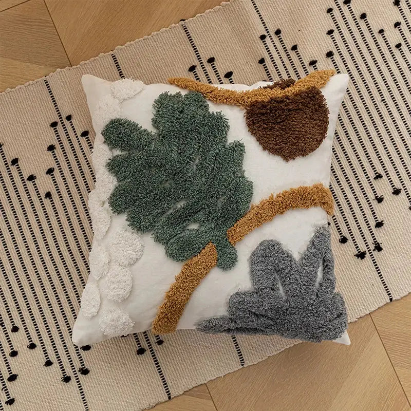 White bohemian loop plush cushion cover with textured green leaves brown acorn and gray foliage for living room decor