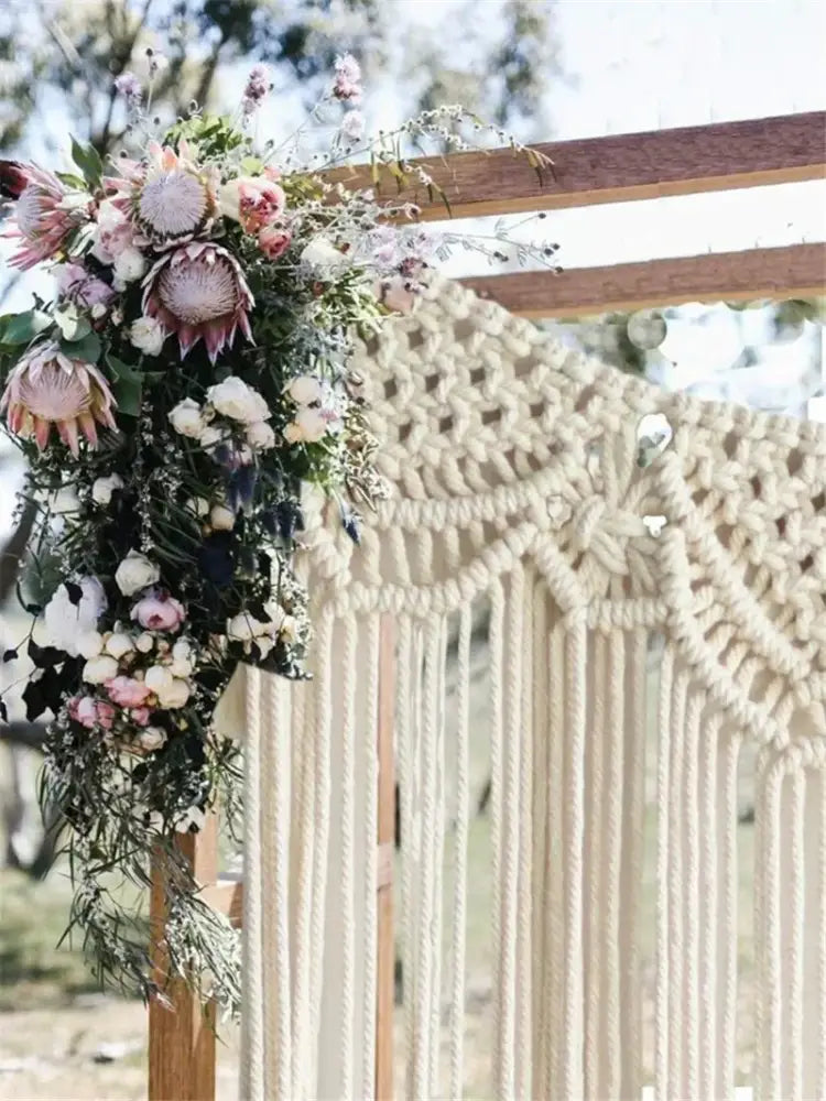 Cream-colored decorbites bohemian macrame curtain tapestry with intricate knotwork and long fringe for living room decor