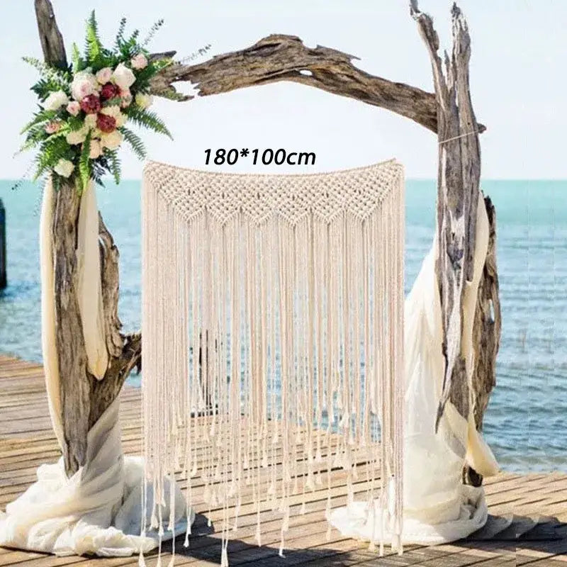 Beige bohemian macrame curtain tapestry with intricate woven top and long fringe on driftwood arch decorbites bohemian macrame