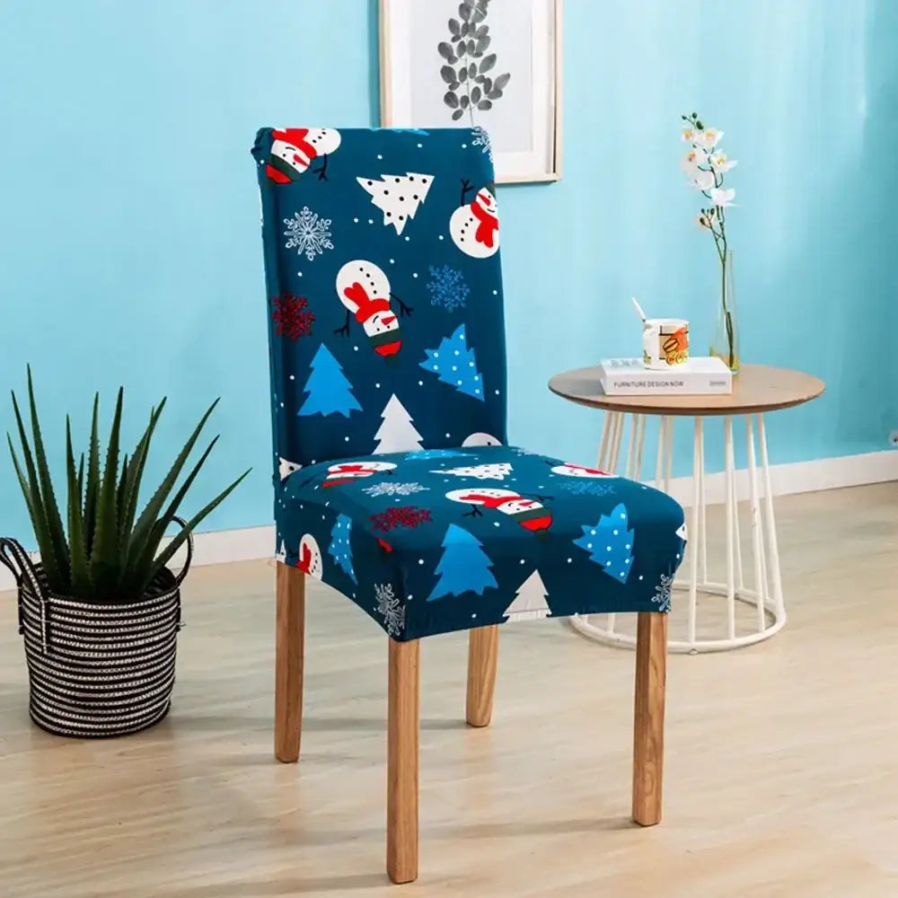 Blue christmas-themed bohemian mandala stretch chair cover with snowmen trees and snowflakes on navy fabric
