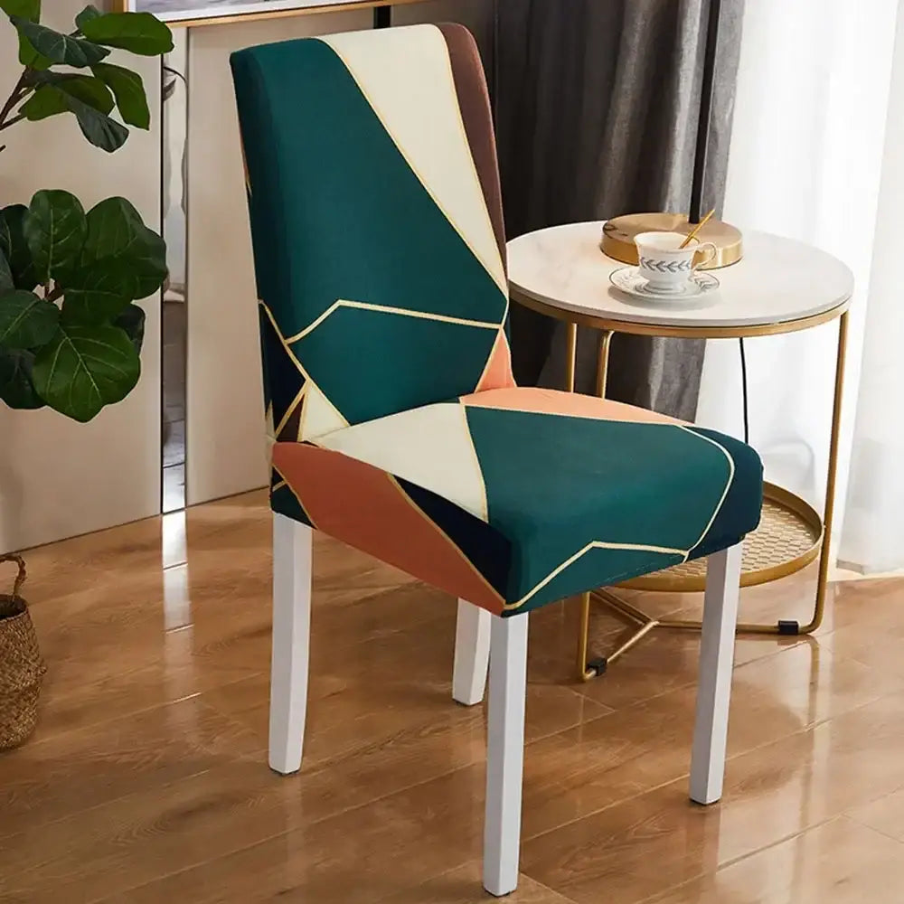 A modern bohemian mandala stretch chair cover in teal cream and terracotta with gold trim for dining room decorbites bohemian mandala