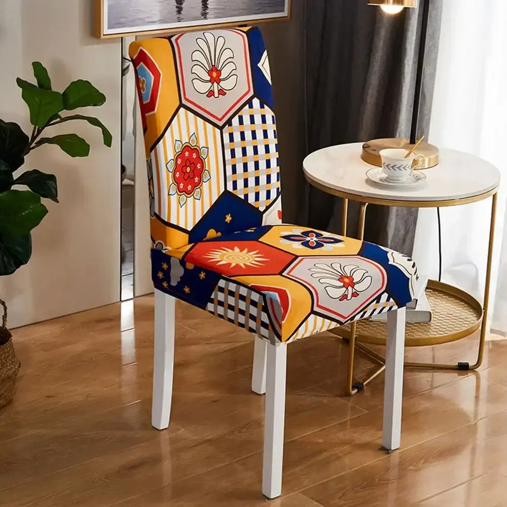 A vibrant bohemian mandala stretch chair cover with bold yellow blue red and white hexagonal patchwork design for dining room decorbites bohemian mandala