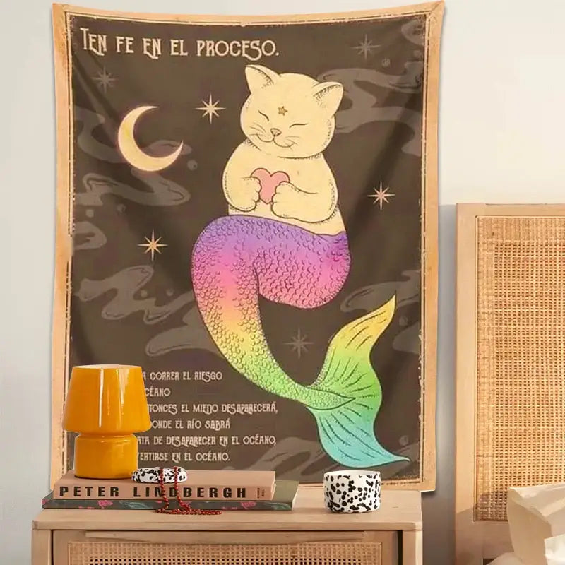 Bohemian moon cat wall tapestry featuring a pastel yellow cat mermaid with a rainbow tail on dark background decorbites cat tapestry