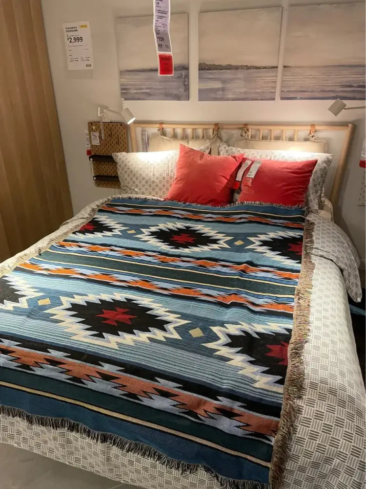 A decorbites bohemian nordic leisure throw featuring teal and orange geometric patterns with fringed edges for bedroom decor