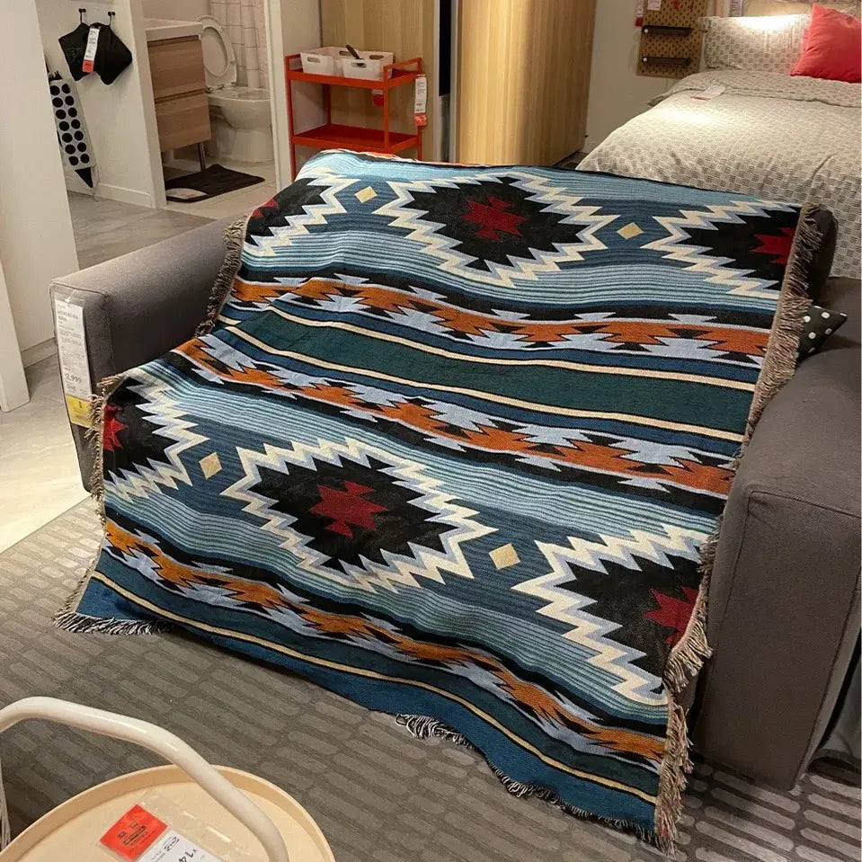 A cozy decorbites bohemian nordic leisure throw blanket with teal orange geometric pattern and fringed edges for bedroom decor