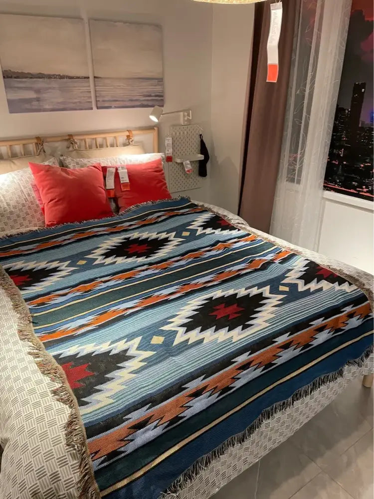 Bohemian nordic leisure throw woven blanket with blue black and orange geometric pattern and fringed edges for decorbites