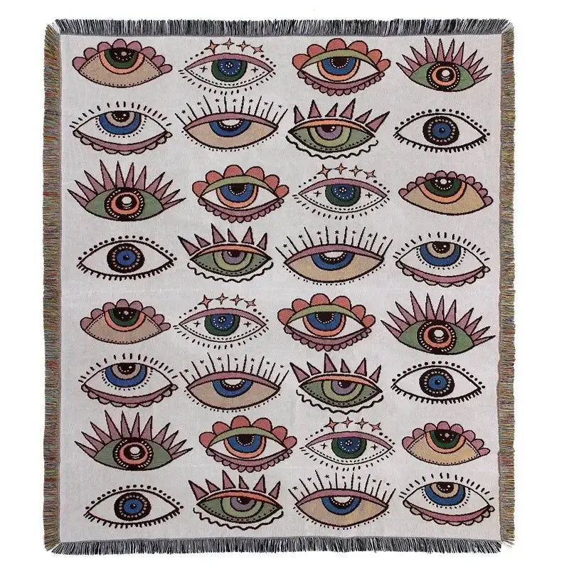 Cream-colored decorbites bohemian outdoor blanket with stylized eye pattern and fringed edges for living room throw use