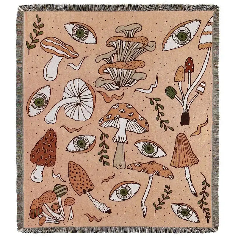 Beige woven decorbites bohemian outdoor blanket with whimsical mushroom eye pattern and fringed edges for living room use