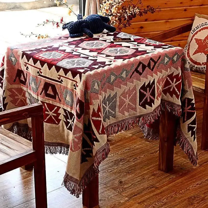 Bohemian pink and red knitted cotton throw blanket with geometric woven pattern and fringed edges for bedroom decorbites decor