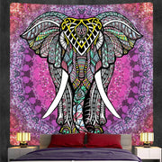Bohemian purple and pink god mandala tapestry featuring a decorbites elephant god with ornate tribal designs for bedroom decor