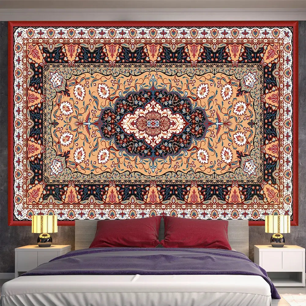 A vibrant indian mandala tapestry with an orange black and cream floral medallion for bedroom wall decor