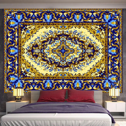 Vibrant blue and gold ornate indian mandala tapestry from decorbites hanging above a bed for bedroom decor