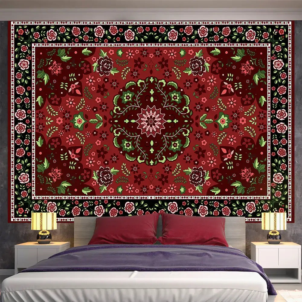 A richly detailed red and green bohemian indian mandala tapestry hanging as bedroom wall decor by decorbites