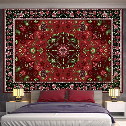 A bohemian red and gold indian mandala tapestry with intricate floral patterns used as bedroom wall decor