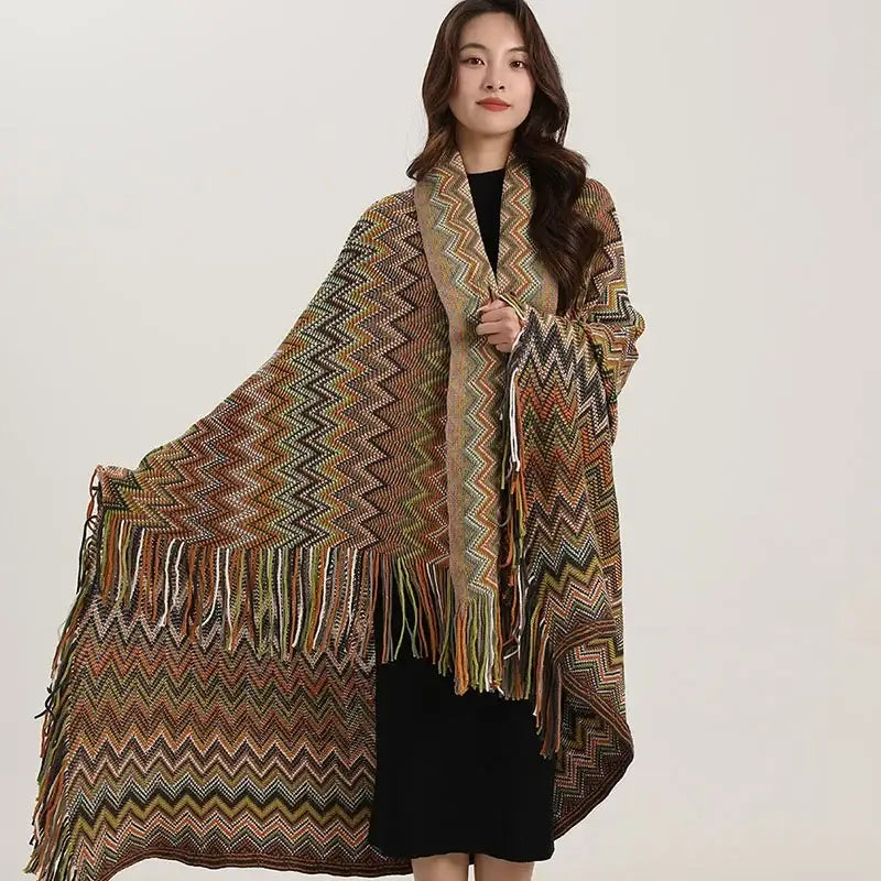 Bohemian red and teal wavy fringe shawl with vibrant zigzag pattern and fringe edges used as living room blanket