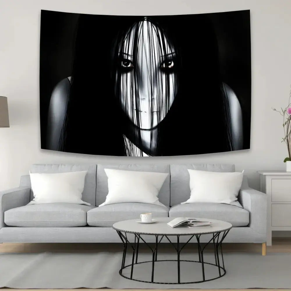 Black and white bohemian sadakos wall tapestry featuring a stylized woman hanging above a gray sofa for decorbites decor