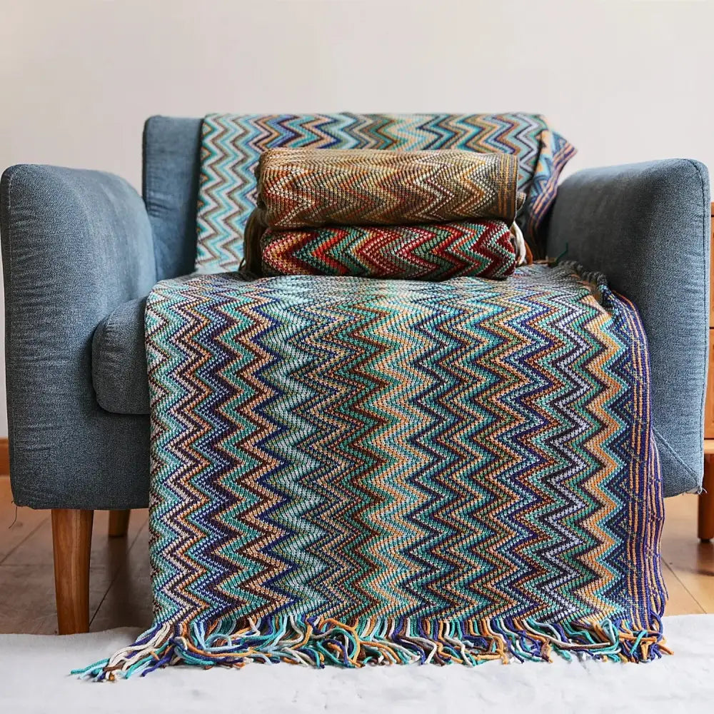 Vibrant multicolored knit bohemian stripe throw blanket with zigzag pattern and fringed edges for living room decorbites decor