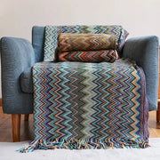 Vibrant multicolored knit bohemian stripe throw blanket with zigzag pattern and fringed edges for living room decorbites decor
