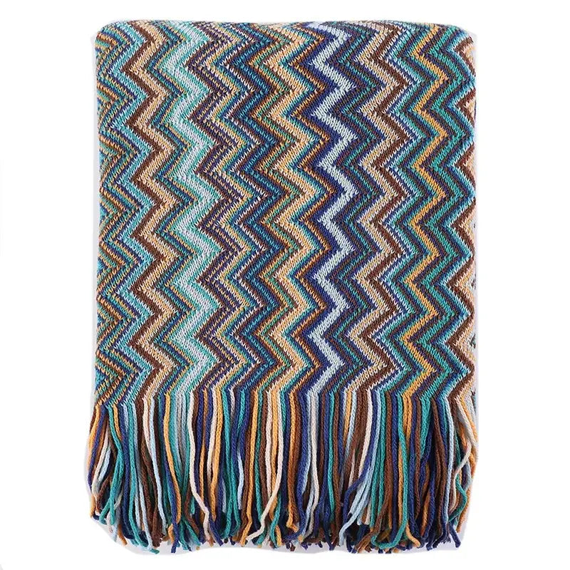 Bohemian stripe throw blanket with bold teal blue brown zigzag knit pattern and matching fringe for living room decorbites
