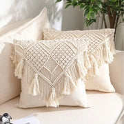 Cream-colored bohemian style beige macrame cushion cover with intricate geometric knotting and long fringe tassels decorbites