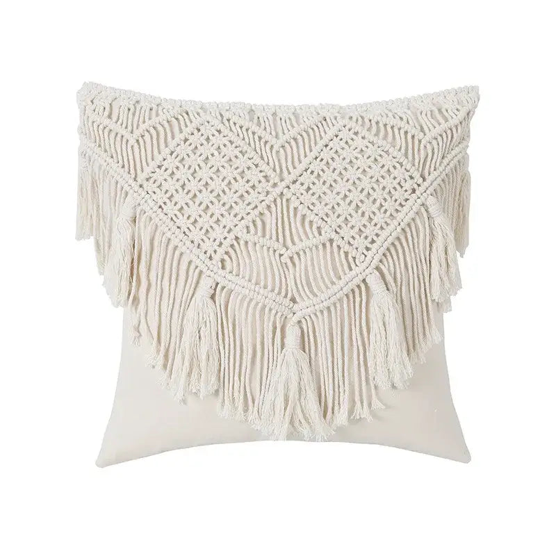 Cream-colored bohemian style beige macrame cushion cover with intricate woven patterns and long fringe tassels for living room decor