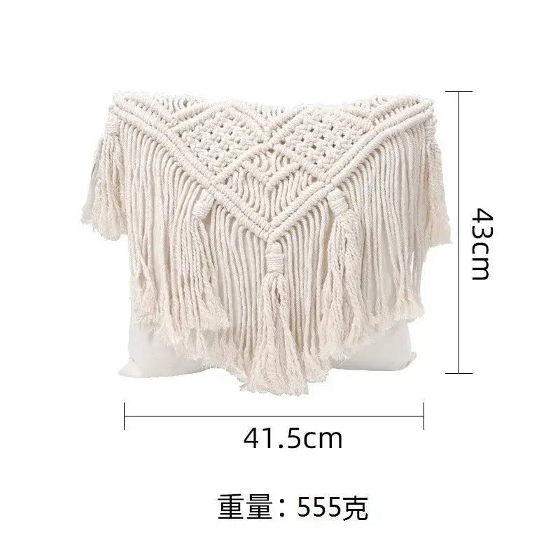 Cream-colored bohemian style beige macrame cushion cover with intricate woven patterns and long fringe tassels decorbites