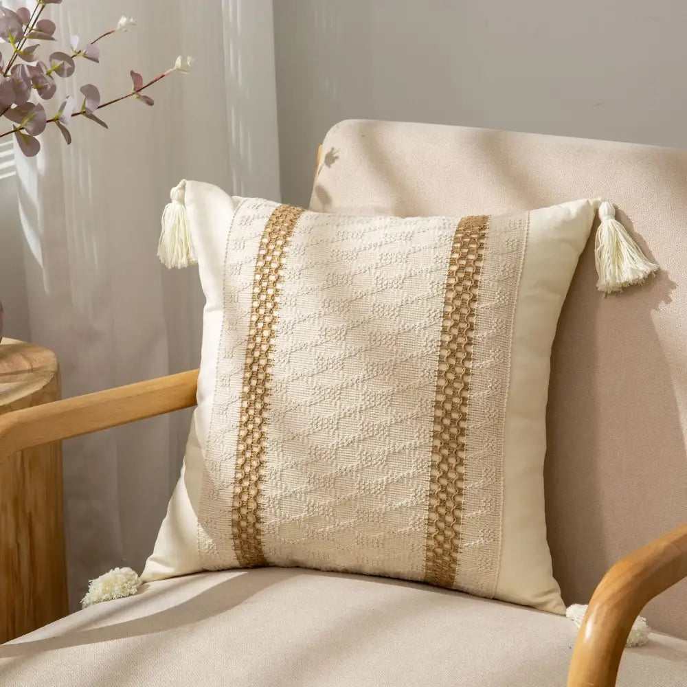 Cream-colored pillow cover with textured beige woven stripes and tassels decorbites bohemian style fringed design