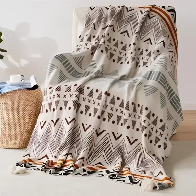 Beige decorbites bohemian tassel knit blanket with geometric patterns in muted green brown and black for living room decor