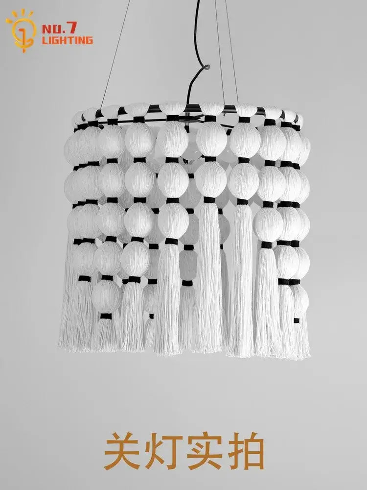 White bohemian tassel pendant led light with tiered paper globes and macrame tassels by decorbites for bedroom decor