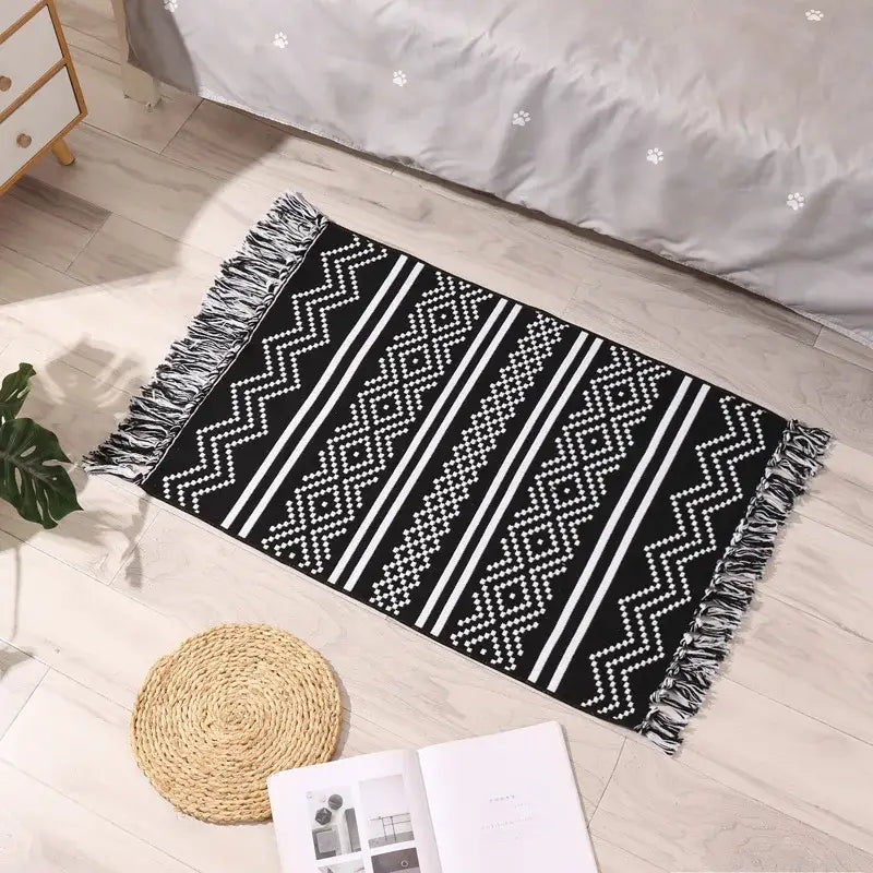 Black and white woven decorbites bohemian tassel rug with geometric patterns and fringed edges for living room decor