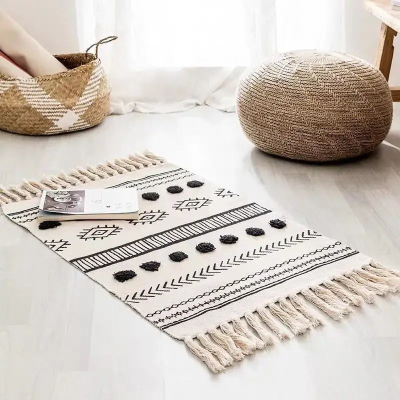Beige and black bohemian tassel rug with geometric pattern tassels and pom-poms by decorbites for living room decor