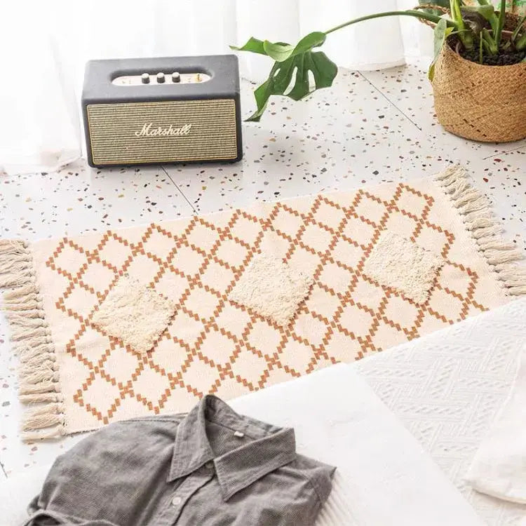 Beige and brown geometric-patterned bohemian tassel rug with textured patches and fringe by decorbites bohemian tassel