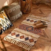 Beige woven decorbites bohemian tassel rug with rust navy blue geometric patterns and fringed edges for living room decor