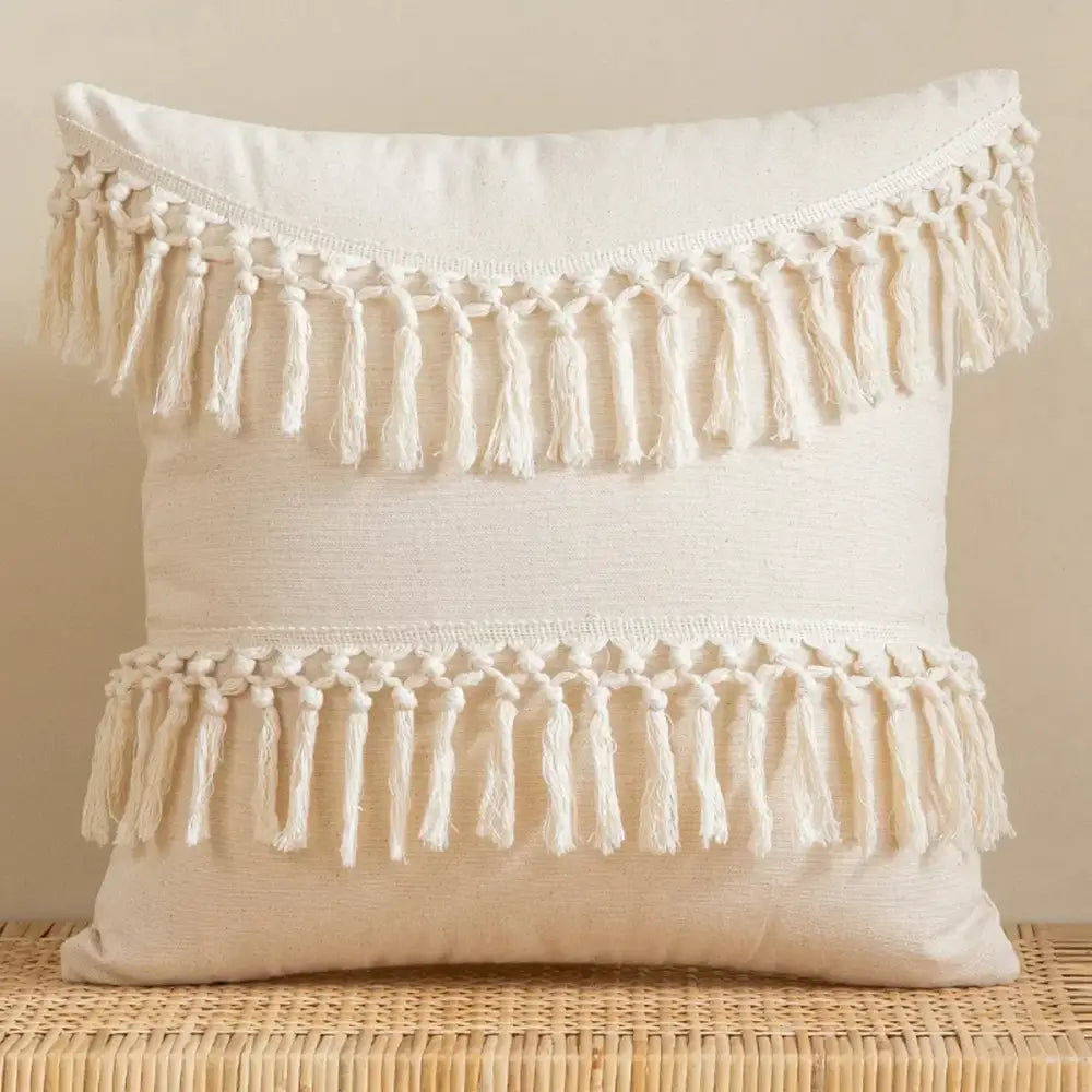 Beige bohemian tufted tassel pillow with cream cushion and two rows of hand-knotted tassels for living room decor