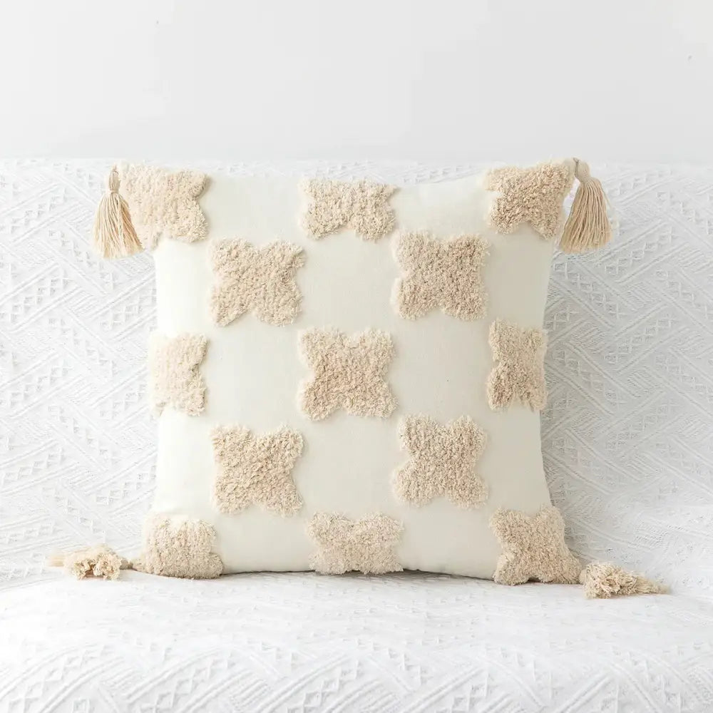 Cream-colored decorbites bohemian tufted tassel pillow case with plush cross appliqués and tassels for living room decor