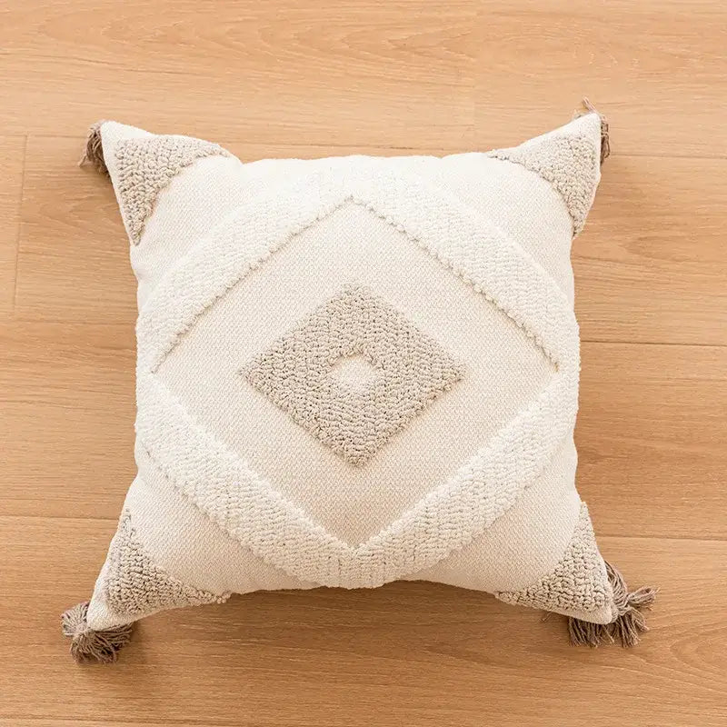 Cream-colored bohemian tufted tassel pillow with textured diamond pattern and beige tassels for living room decorbites decor