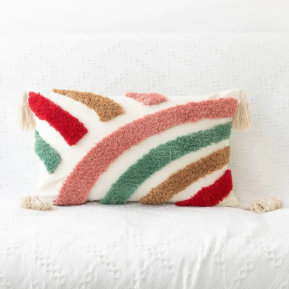 Decorbites bohemian tufted tassel pillow featuring colorful striped yarn and tassels on a beige geometric cushion cover