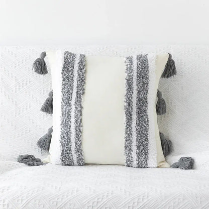 Cream-colored bohemian tufted tassel pillow with textured gray white stripes for geometric living room decorbites decor