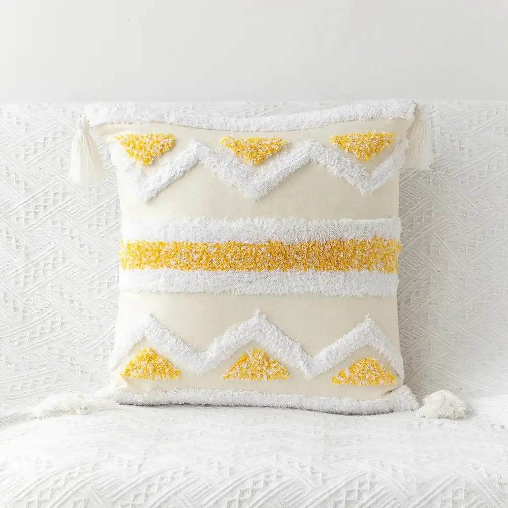 Cream-colored bohemian tufted tassel pillow case with textured yellow and white geometric patterns for living room decorbites
