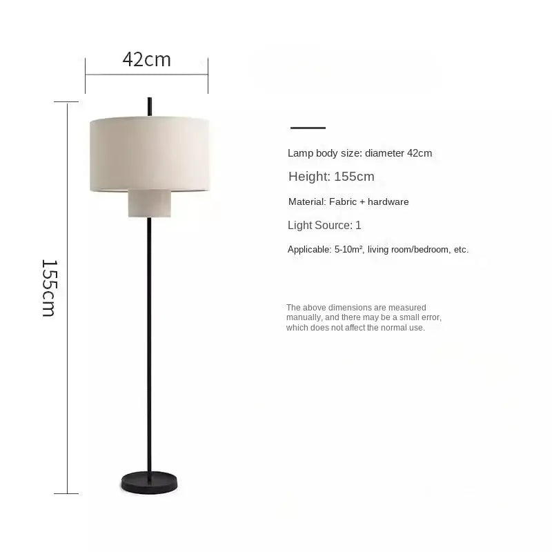 A sleek black floor lamp with off-white fabric shade and minimalist hardware in decorbites bohemian wabi sabi style
