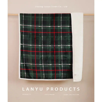 A cozy bohemian winter blanket in green red and white plaid with soft fleece lining for living room use