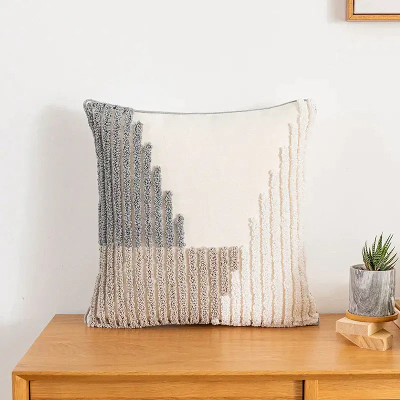 A textured square cushion cover with a modern abstract grey and cream design for home decoration decorbites boho style