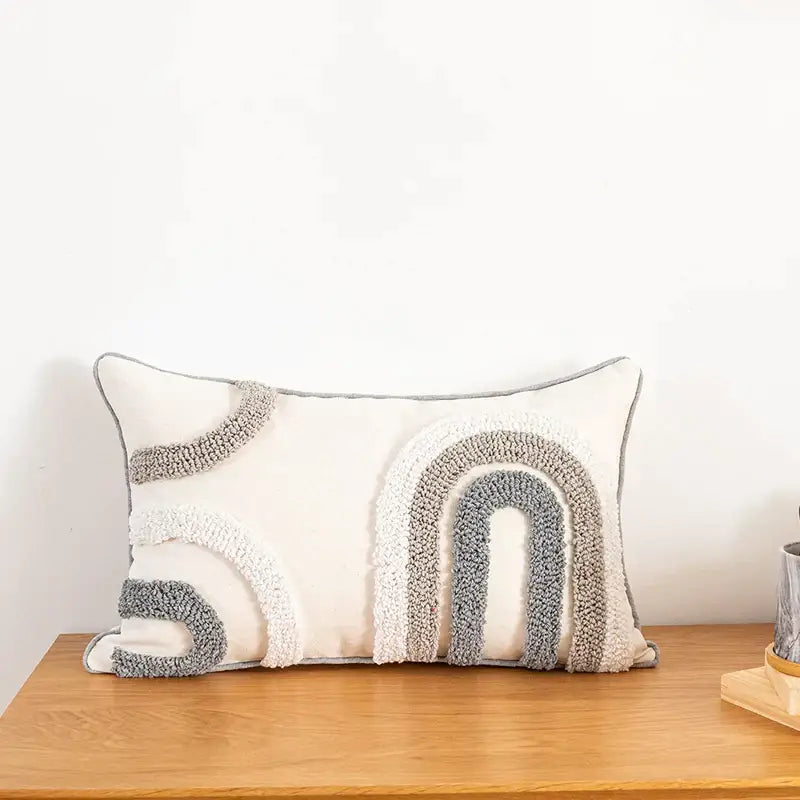 Cream-colored cushion cover with textured chunky knit rainbow arches in gray and off-white for home decoration decorbites boho style