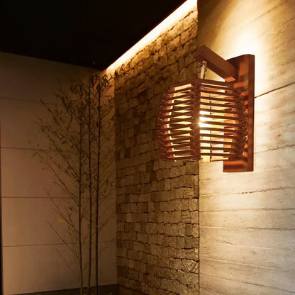 Warm-toned bamboo wall sconce light with woven lattice design ideal for boho corridor decor