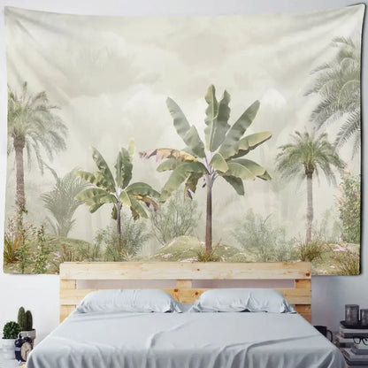 Boho banana tree mist tapestry wall hanging in soft green and beige featuring palm and banana tree motifs above wooden bed