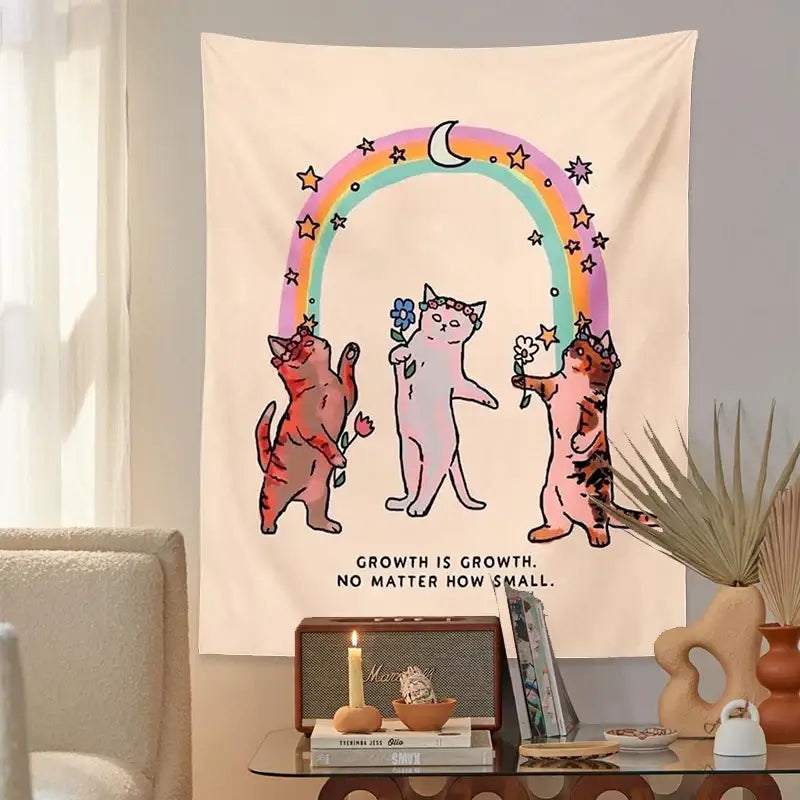 Cream-colored decorbites cat tapestry wall hanging featuring whimsical cartoon cats under a starry rainbow arch